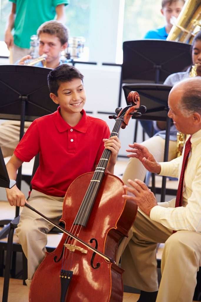 young student listening to his cello instructor